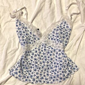 white laced top with blue flowers
